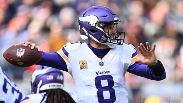 Oct 15, 2023; Chicago, Illinois, USA; Minnesota Vikings quarterback Kirk Cousins (8) passes in the first half against the Chicago Bears at Soldier Field.
